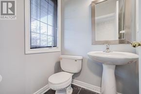 Aurora apartment for rent - A white toilet and sink in a bathroom.