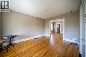 Windsor apartment for rent - A room with wooden floors and a table in it.