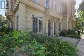 Toronto (Bridle Path-Sunnybrook-York Mills) townhouse for rent - A large, well-maintained house with a garden in front.