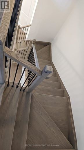 Brampton (Bram West) townhouse for rent - A staircase with wooden steps and a metal railing.