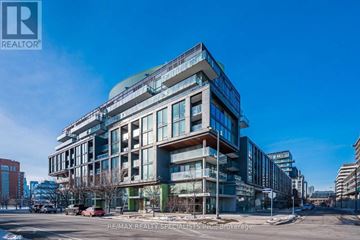 Toronto (Waterfront Communities) condo for rent - A modern multi-story building with a glass facade and balconies.
