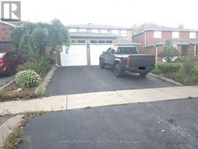 Toronto (West Humber-Clairville) apartment for rent - A black truck is parked in a driveway.
