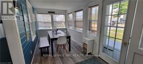 Fort Erie (Crystal Beach) apartment for rent - A dining area with a table and chairs is shown in the image.