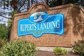 Collingwood condo for rent - A blue and white sign that says Rupert's Landing.