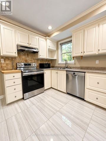 Mississauga (Lakeview) apartment for rent - A kitchen with white cabinets and a tile floor.