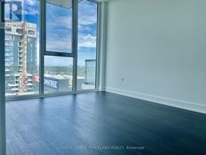 Toronto (Banbury-Don Mills) condo for rent - A room with a view of a cityscape through large windows.