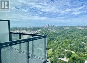 Toronto (Banbury-Don Mills) condo for rent - A balcony with a glass railing overlooks a cityscape.