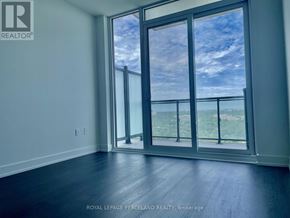 Toronto (Banbury-Don Mills) condo for rent - A room with a large window overlooking a landscape.