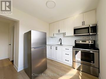 Toronto (Dovercourt-Wallace Emerson-Junction) apartment for rent - A kitchen with a stainless steel refrigerator, oven, and microwave.