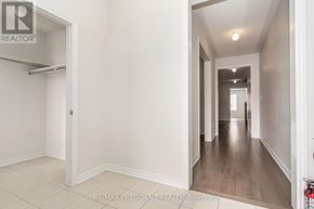 Shelburne apartment for rent - A long hallway with a white door on the left and a white wall on the right.