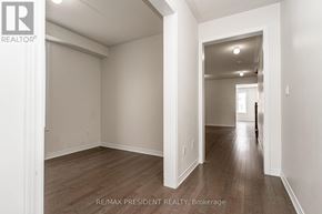 Shelburne apartment for rent - A spacious room with wooden flooring and white walls.