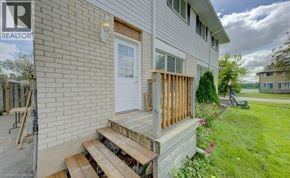 Cambridge apartment for rent - A house with a white door and a wooden porch.