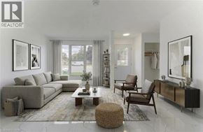 Cambridge apartment for rent - A well-lit, modern living room with a grey sofa, a coffee table, and a large mirror on the wall.