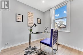 Hamilton (Landsdale) apartment for rent - A room with a blue chair and a poster on the wall.