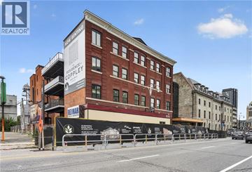 Hamilton apartment for rent - A building with a sign that says "Residence Coppley".