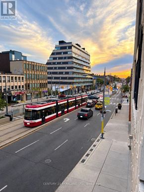 Toronto (Oakwood Village) condo for rent - A room with a glass door and wooden flooring.