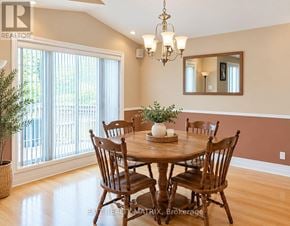 Casselman duplex for rent - A dining room with a wooden table and chairs.