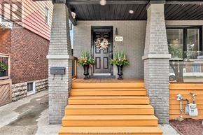 Windsor apartment for rent - A house entrance with a black door and a grey pillar.