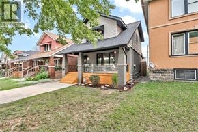Windsor apartment for rent - A house with a grey roof and a brown door.