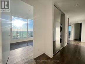 Vaughan (Vaughan Corporate Centre) condo for rent - A sunny day is reflected in the glass door of a modern home.