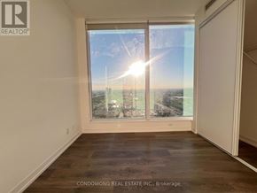 Vaughan (Vaughan Corporate Centre) condo for rent - A sunny day is seen through the window of an empty room.