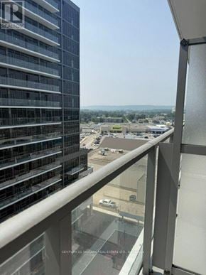 Milton (Tm Timberlea) condo for rent - A view from a balcony of a tall building with a glass railing.