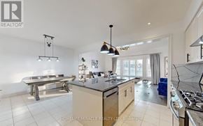 Guelph (Pineridge/Westminster Woods) townhouse for rent - A modern kitchen with a large island and pendant lights.