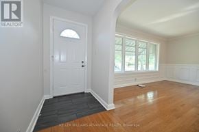 Oshawa (Centennial) apartment for rent - A backyard with a fence and a small shed.