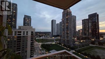 Mississauga (City Centre) condo for rent - A cityscape with tall buildings and a green park area.