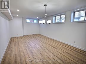 Clarence-Rockland apartment for rent - A large empty room with wooden flooring and white walls.