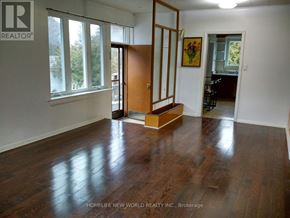 Toronto (Banbury-Don Mills) apartment for rent - A room with a wooden floor and a sliding door.