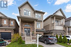 New Tecumseth (Alliston) apartment for rent - A large, multi-level house with a car parked in front.