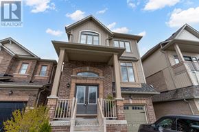 New Tecumseth (Alliston) apartment for rent - A large, multi-story house with a balcony and a garage.