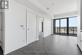 Toronto (Thorncliffe Park) condo for rent - A spacious room with a view of the cityscape through the windows.