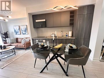 Toronto (Agincourt South-Malvern West) condo for rent - A modern kitchen with a glass table and chairs.