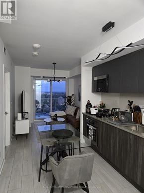 Toronto (Agincourt South-Malvern West) condo for rent - A modern kitchen with a dining table and chairs.