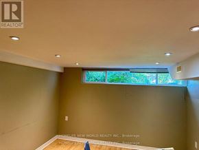 Richmond Hill (Crosby) apartment for rent - A room with a window and a wall that has a logo on it.