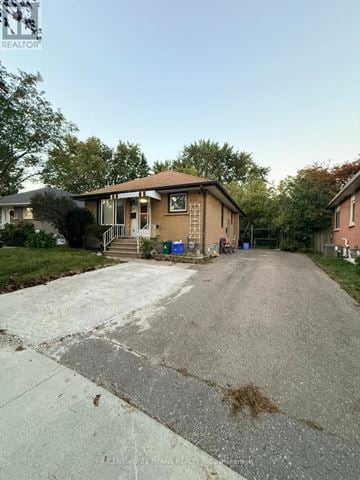 Ajax (South East) apartment for rent - A house with a driveway in front of it.