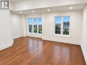 Whitby (Williamsburg) apartment for rent - A room with wooden floors and two windows.