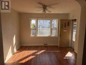 Fort Erie (Central) apartment for rent - A room with a Realty logo on the wall.