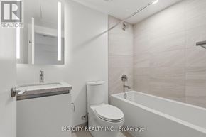 Toronto (Thorncliffe Park) condo for rent - A white bathroom with a toilet, sink, and bathtub.