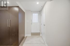 Mississauga (Churchill Meadows) townhouse for rent - A hallway with a brown door and a white door.