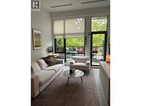 Vancouver apartment for rent - A living room with a white couch and a coffee table.