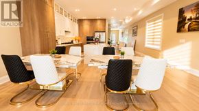 Mississauga (Port Credit) apartment for rent - A modern dining room with a white table and chairs.