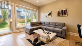Mississauga (Port Credit) apartment for rent - A living room with a grey sofa and a coffee table.