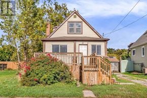 Hamilton (Hamilton Beach) apartment for rent - A house with a brown roof and a wooden fence.