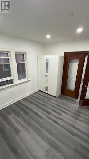 Brampton (Downtown Brampton) apartment for rent - A room with a grey floor and a white wall with a window and a door.