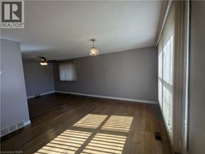 Cambridge apartment for rent - A room with wooden floors and a ceiling fan.