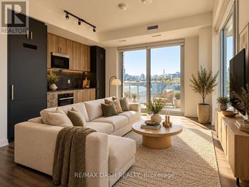Toronto (University) condo for rent - A modern living room with a view of the city.