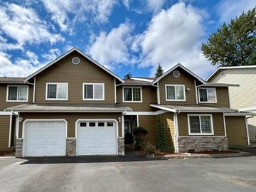 Lynnwood apartment for rent - A two-story house with a garage on the ground floor.